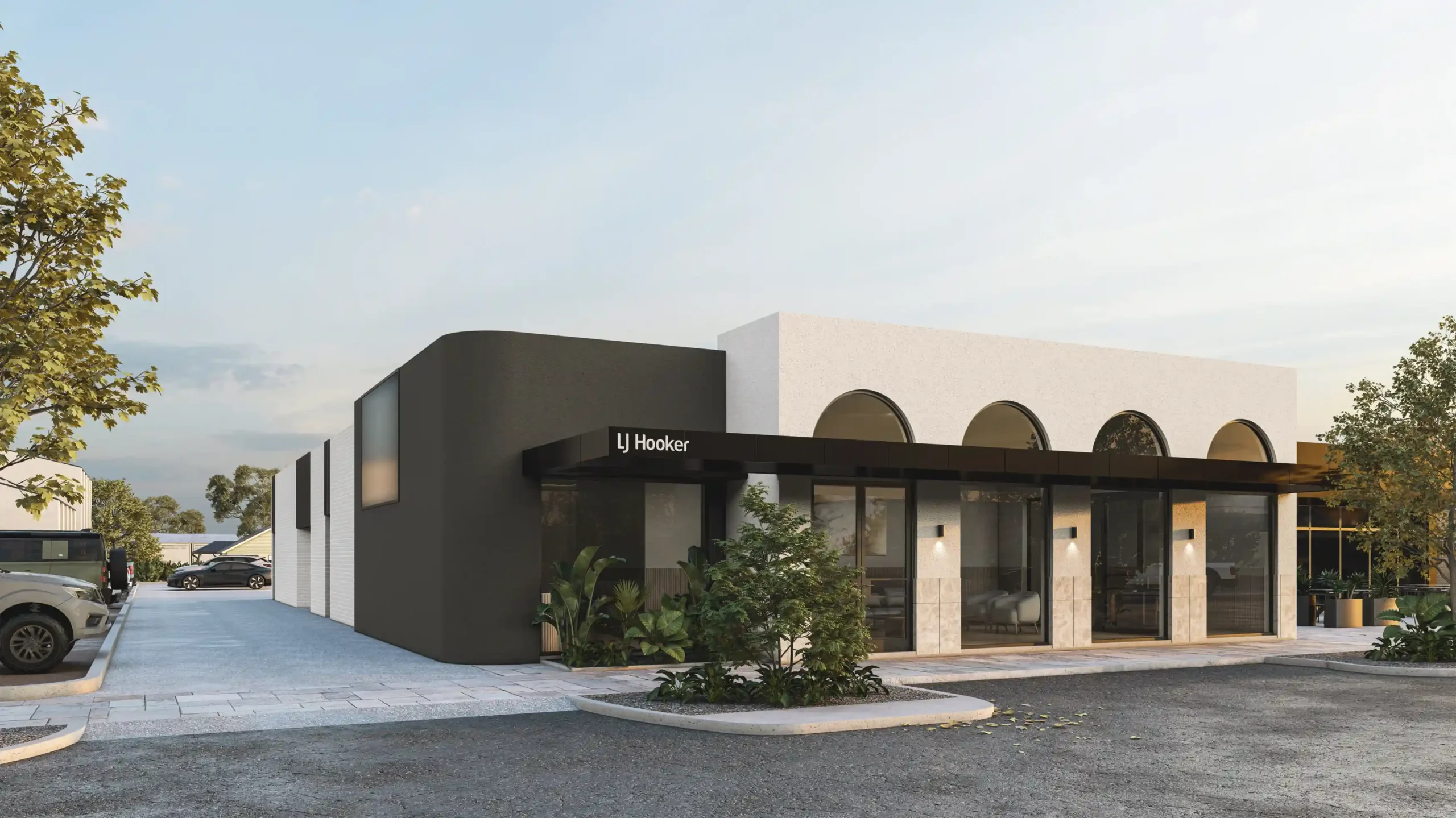 Prince Street Final 02 Architectural render of modern LJ Hooker commercial office building featuring dark curved corner facade, white rendered walls with arched windows, and landscaped entrance